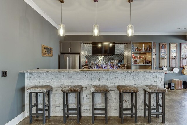 6014 Warpath Rd, Flowery Branch, GA 30542 - indoor dry bar featuring freestanding refrigerator, ornamental molding, concrete floors, backsplash, and hanging light fixtures