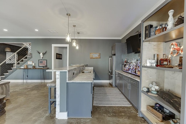 6014 Warpath Rd, Flowery Branch, GA 30542 - kitchen with high end fridge, concrete flooring, a kitchen breakfast bar, gray cabinetry, and crown molding