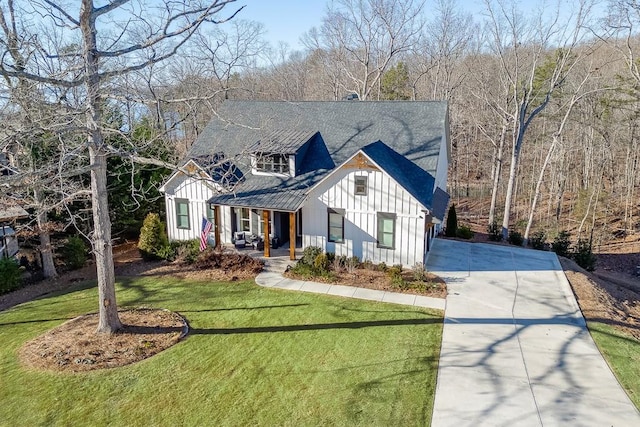 6014 Warpath Rd, Flowery Branch, GA 30542 - modern farmhouse style home with board and batten siding, concrete driveway, covered porch, a front lawn, and roof with shingles