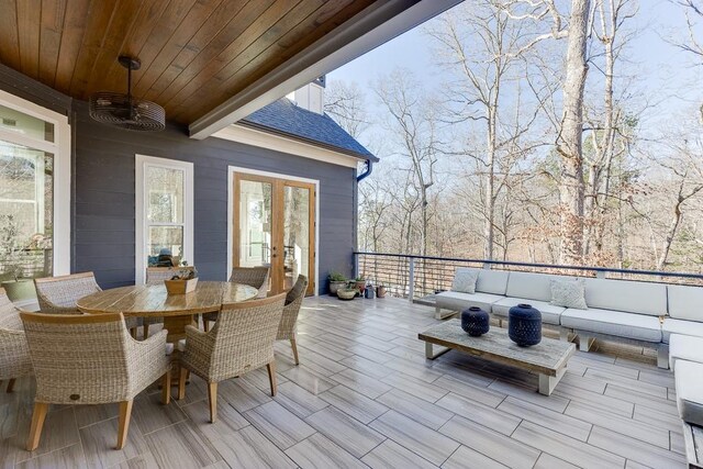 6014 Warpath Rd, Flowery Branch, GA 30542 - deck with french doors, an outdoor hangout area, and outdoor dining space