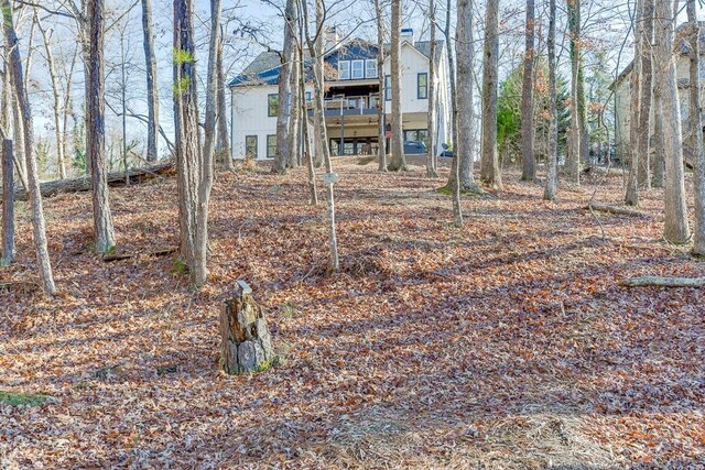 6014 Warpath Rd, Flowery Branch, GA 30542 - back of property with a balcony