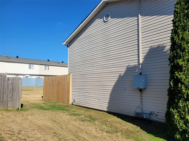 view of property exterior featuring a lawn