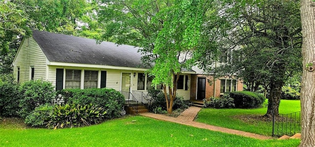 view of front of property with a front lawn