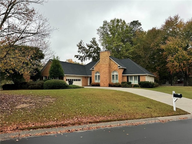 view of front of house with brick siding, a chimney, concrete driveway, an attached garage, and a front lawn