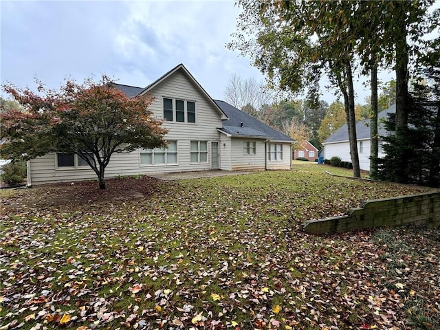 back of house with a patio