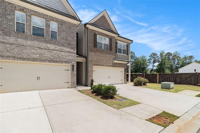 2700 Norwich Trce, Snellville, GA 30078 - view of front of home featuring brick siding, an attached garage, and concrete driveway