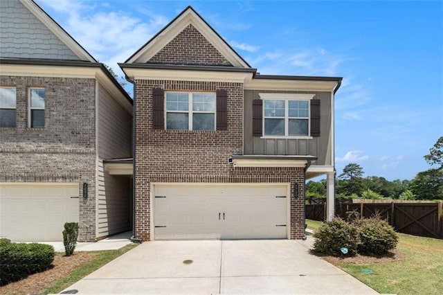 2700 Norwich Trce, Snellville, GA 30078 - view of front of home with brick siding, a garage, concrete driveway, and board and batten siding