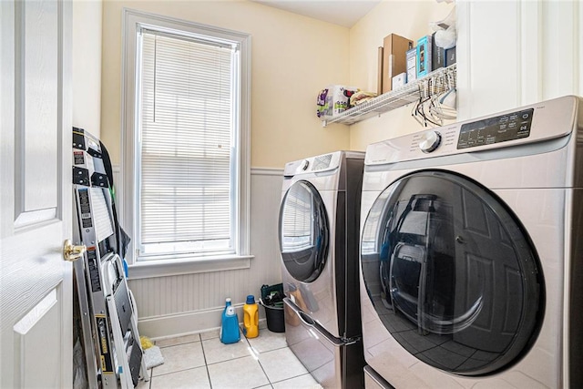 725 Windsor Place Cir SW, Grayson, GA 30017 - laundry room featuring independent washer and dryer, tile patterned floors, and wainscoting