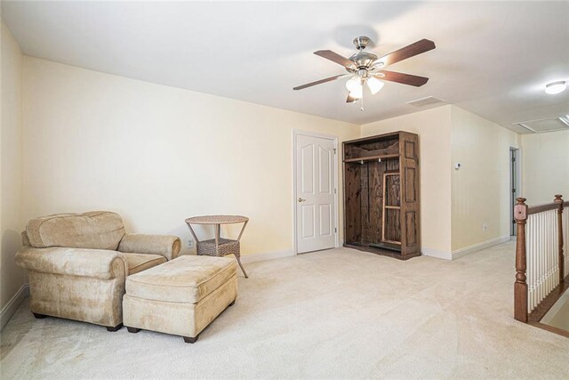 725 Windsor Place Cir SW, Grayson, GA 30017 - living area featuring attic access, ceiling fan, carpet flooring, baseboards, and an upstairs landing