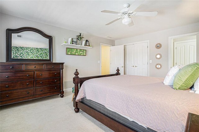 725 Windsor Place Cir SW, Grayson, GA 30017 - bedroom with light colored carpet, a closet, and a ceiling fan