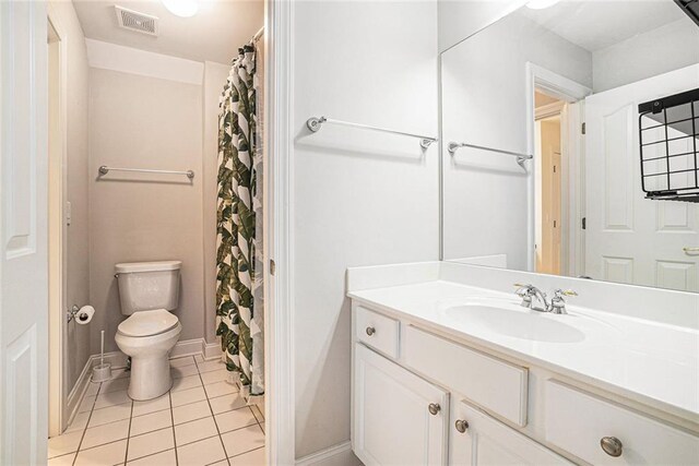 725 Windsor Place Cir SW, Grayson, GA 30017 - bathroom with tile patterned floors, toilet, baseboards, and vanity