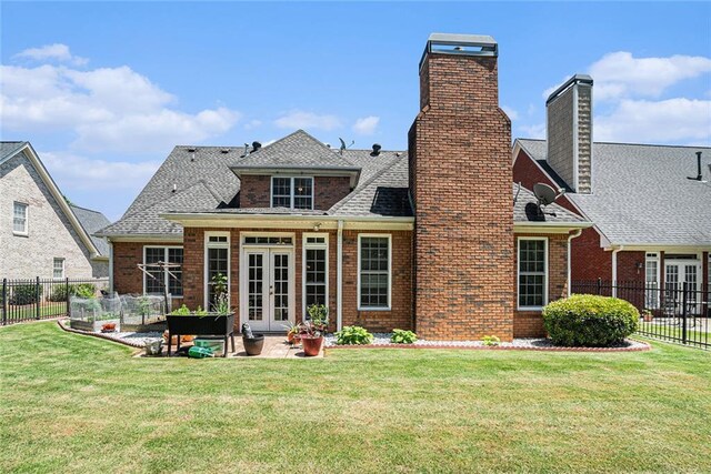 725 Windsor Place Cir SW, Grayson, GA 30017 - back of house with french doors, brick siding, a chimney, and a patio area