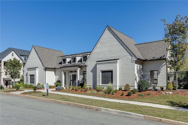 view of front of home with a front lawn