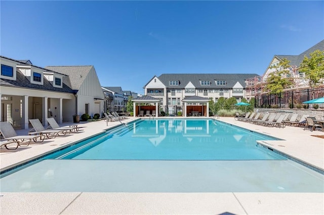 view of swimming pool featuring a patio area