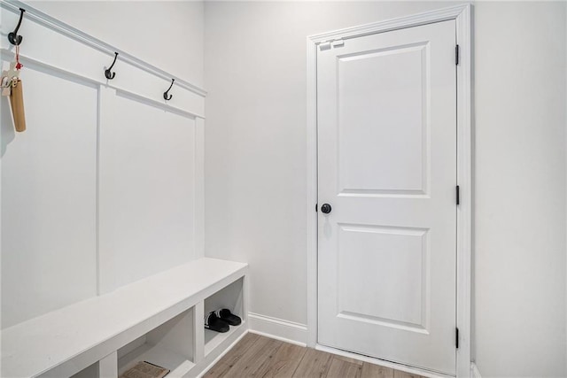 mudroom with light wood-type flooring and baseboards