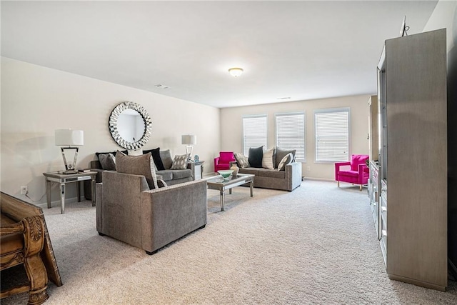 living area with light colored carpet