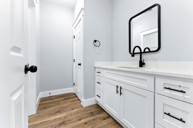 112 Radian Ct, Dallas, GA 30132 - bathroom with wood finished floors, vanity, and baseboards