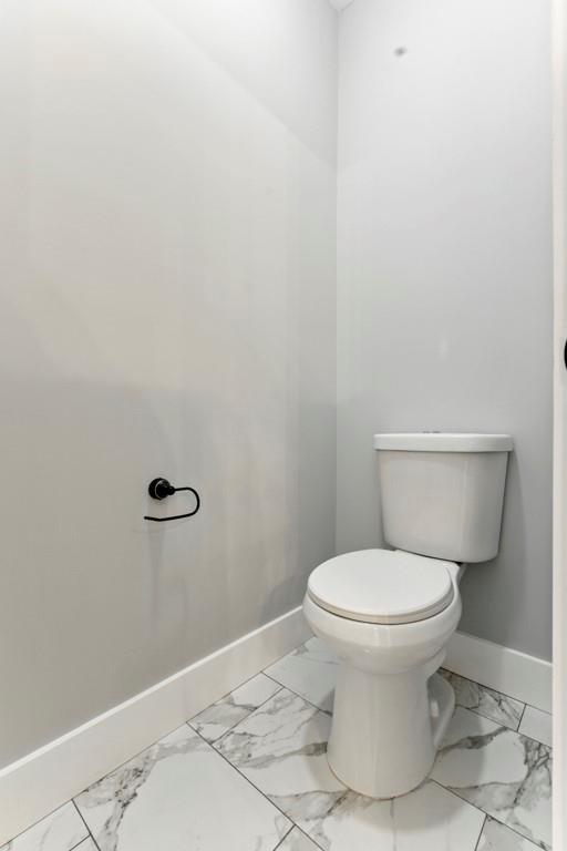 112 Radian Ct, Dallas, GA 30132 - bathroom with baseboards, marble finish flooring, and toilet