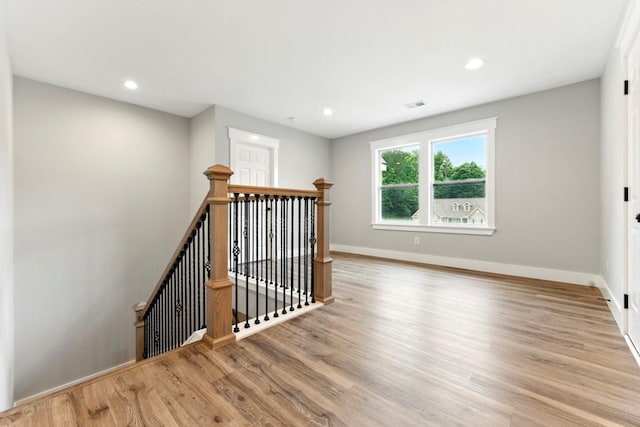 112 Radian Ct, Dallas, GA 30132 - spare room featuring wood finished floors, baseboards, and recessed lighting