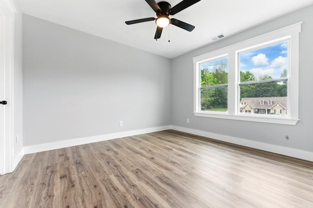112 Radian Ct, Dallas, GA 30132 - empty room with wood finished floors, baseboards, and ceiling fan