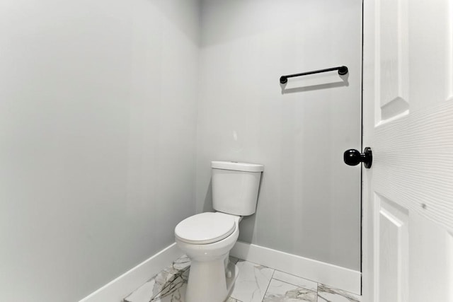 112 Radian Ct, Dallas, GA 30132 - bathroom with baseboards, toilet, and marble look tile flooring