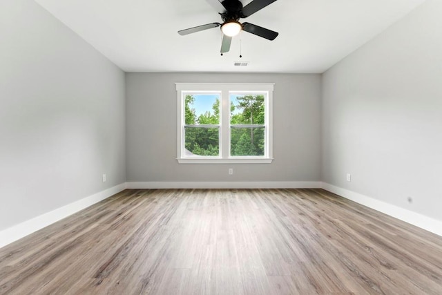 112 Radian Ct, Dallas, GA 30132 - spare room featuring baseboards, wood finished floors, and a ceiling fan