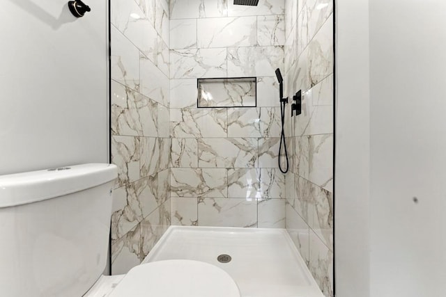 112 Radian Ct, Dallas, GA 30132 - bathroom featuring toilet and tiled shower