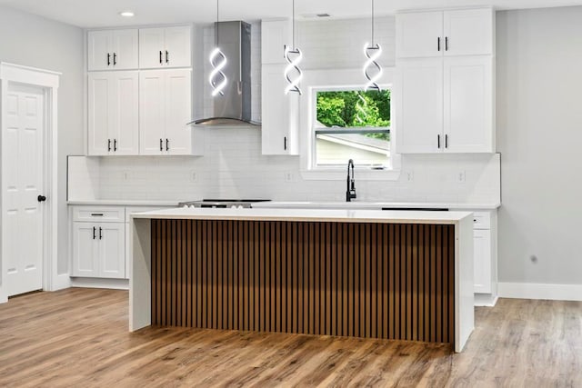 112 Radian Ct, Dallas, GA 30132 - kitchen featuring extractor fan, light wood finished floors, and white cabinets