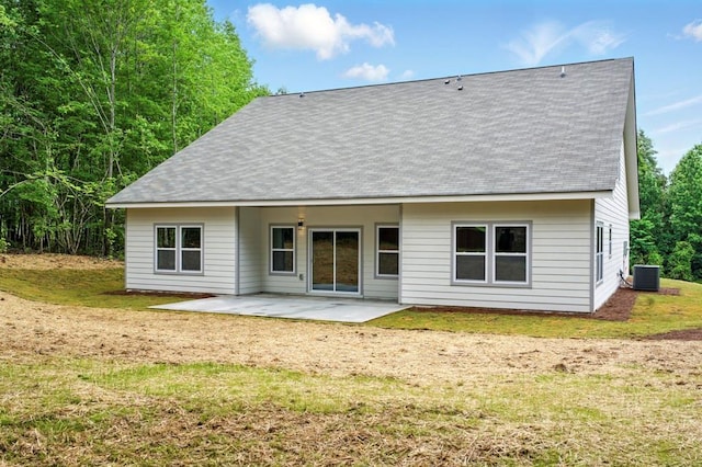 112 Radian Ct, Dallas, GA 30132 - back of property featuring a patio area, a yard, roof with shingles, and central AC