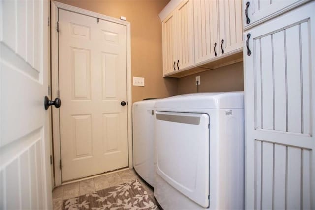 clothes washing area featuring cabinet space