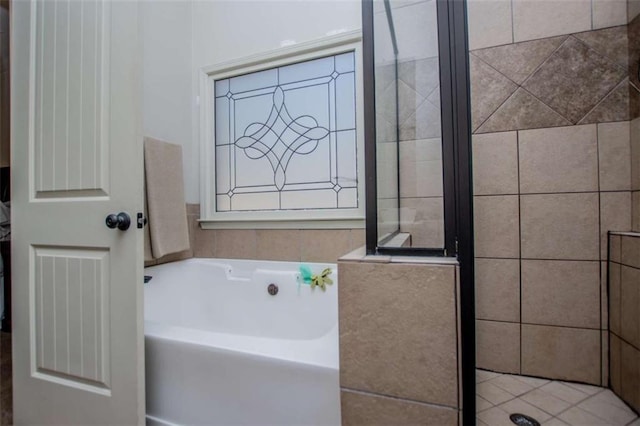 bathroom with a garden tub and a stall shower