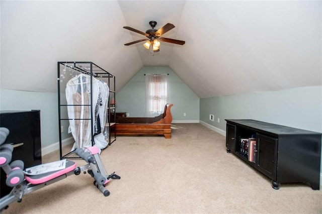 bedroom with a ceiling fan, vaulted ceiling, light colored carpet, and baseboards