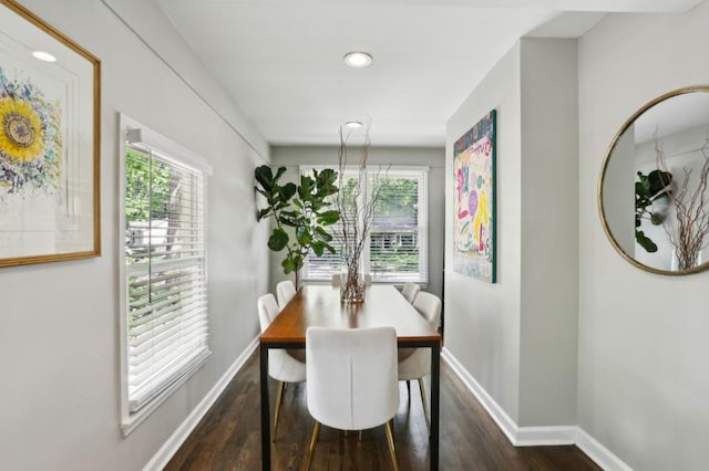 dining room featuring dark wood-type flooring, recessed lighting, baseboards, and a healthy amount of sunlight
