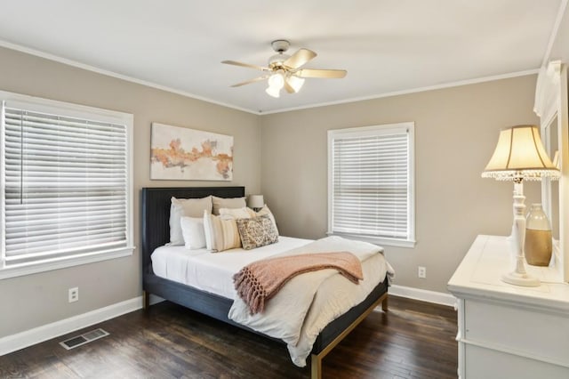 bedroom with baseboards, ornamental molding, dark wood-style flooring, and visible vents