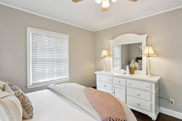 bedroom with crown molding, baseboards, a ceiling fan, and dark wood-type flooring