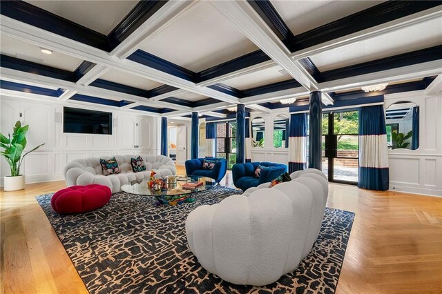 living room with ornamental molding, coffered ceiling, beam ceiling, and light hardwood / wood-style flooring