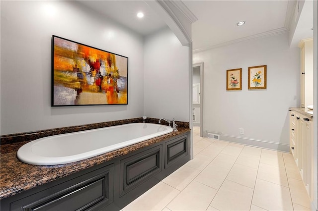 bathroom with vanity, a bathtub, crown molding, and tile patterned floors