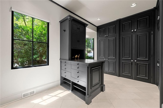 walk in closet featuring light tile patterned floors