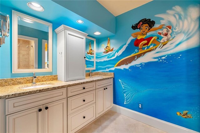 bathroom with vanity and tile patterned floors