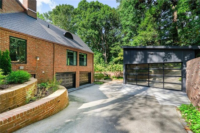 view of side of home with a garage