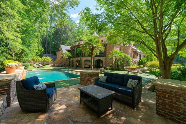 view of swimming pool featuring an outdoor hangout area and a patio area