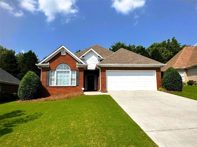 114 Vinings Way SE, Calhoun, GA 30701 - view of front of house featuring a garage, a front lawn, concrete driveway, and brick siding