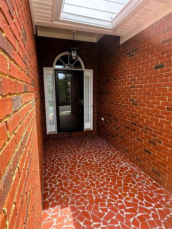 114 Vinings Way SE, Calhoun, GA 30701 - ranch-style home with brick siding, a garage, driveway, and a front lawn
