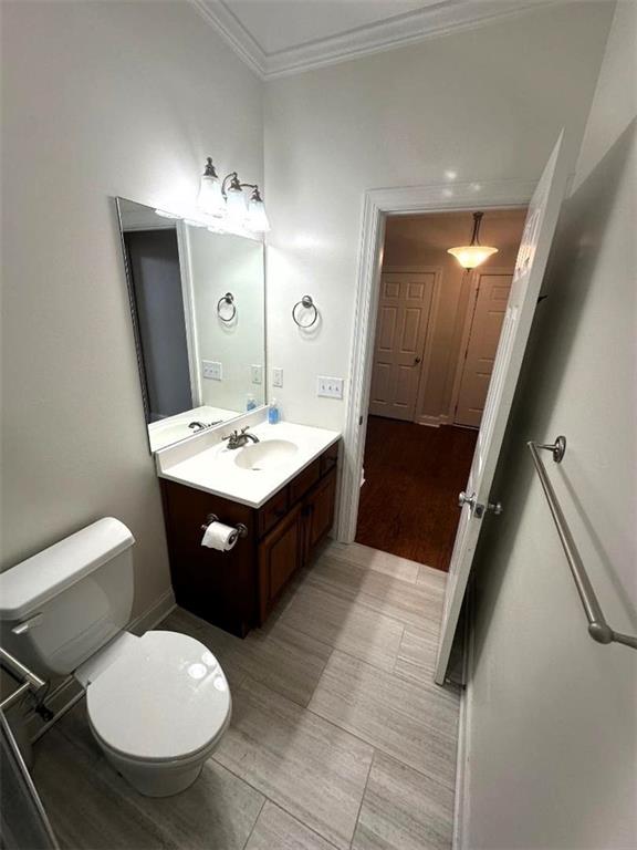 114 Vinings Way SE, Calhoun, GA 30701 - half bath with toilet, crown molding, vanity, and baseboards