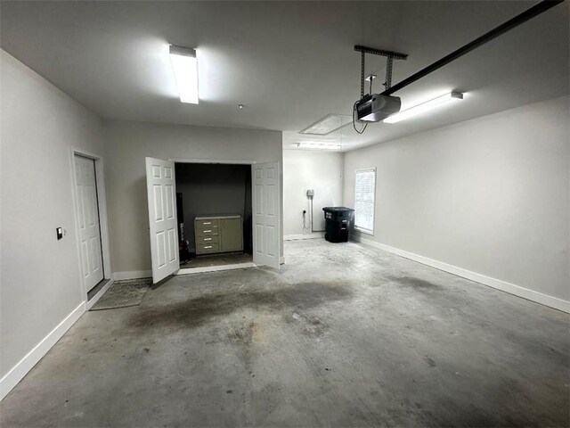 114 Vinings Way SE, Calhoun, GA 30701 - garage featuring a garage door opener and baseboards