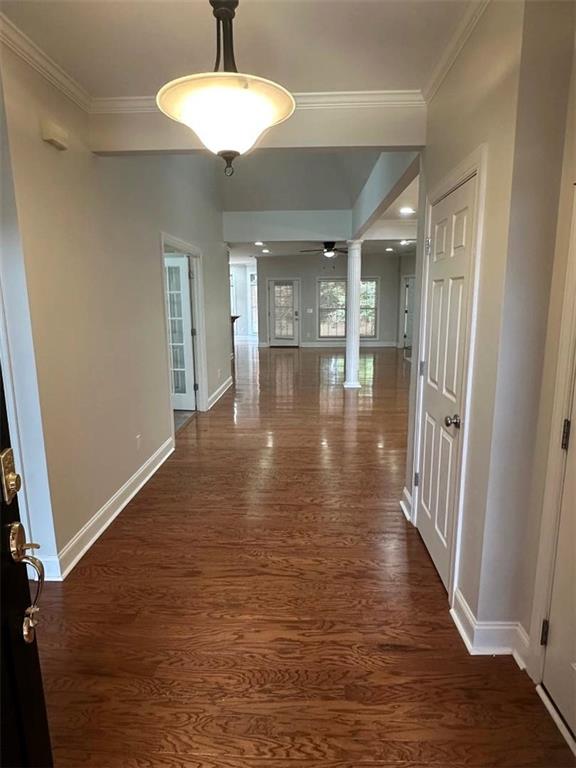 114 Vinings Way SE, Calhoun, GA 30701 - unfurnished living room featuring a ceiling fan, crown molding, a premium fireplace, baseboards, and wood finished floors
