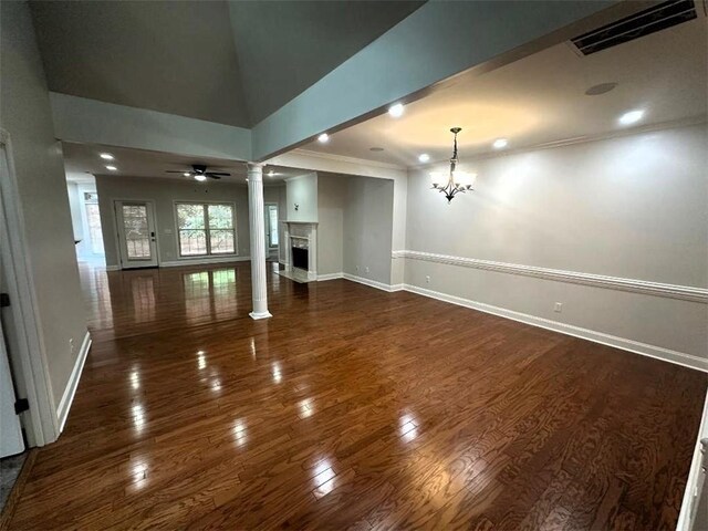 114 Vinings Way SE, Calhoun, GA 30701 - spare room with a chandelier, crown molding, dark wood-style floors, baseboards, and recessed lighting