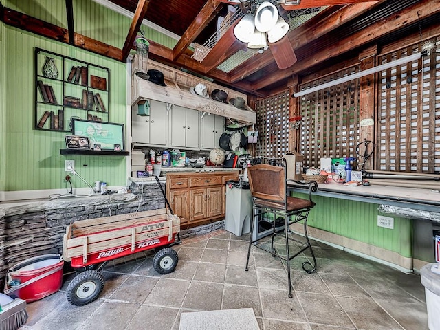 miscellaneous room with ceiling fan and beam ceiling