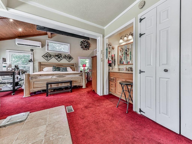 bedroom with a wall mounted air conditioner, a textured ceiling, carpet, crown molding, and lofted ceiling with beams