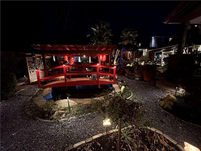 exterior space featuring a pergola and a deck